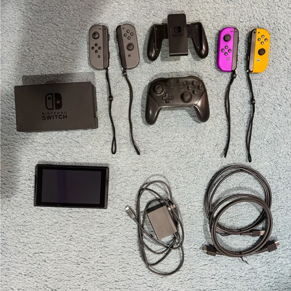Nintendo Switch with Gray, Purple, and Orange Joy-Con Controllers
